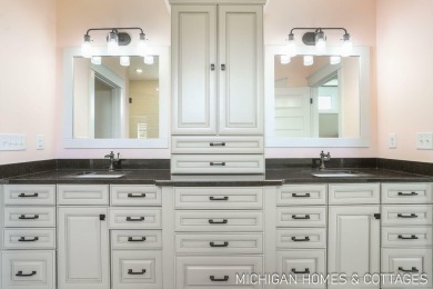 Welcome to 4401 Grand Point, a stunning home nestled on nearly on The Macatwa Legends Golf Course in Michigan - for sale on GolfHomes.com, golf home, golf lot