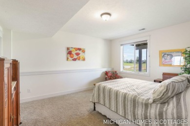Welcome to 4401 Grand Point, a stunning home nestled on nearly on The Macatwa Legends Golf Course in Michigan - for sale on GolfHomes.com, golf home, golf lot