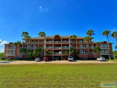 Enjoy panoramic views of the lake and golf course from this on South Padre Island Golf Club in Texas - for sale on GolfHomes.com, golf home, golf lot