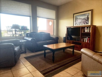 Enjoy panoramic views of the lake and golf course from this on South Padre Island Golf Club in Texas - for sale on GolfHomes.com, golf home, golf lot