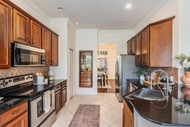 Stop scrolling--this is the one. Tucked inside one of on Westchase Golf Club in Florida - for sale on GolfHomes.com, golf home, golf lot