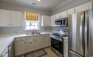 Check out this pristine 2-bedroom, 2-bath furnished villa on Barefoot Resort and Golf Club  in South Carolina - for sale on GolfHomes.com, golf home, golf lot
