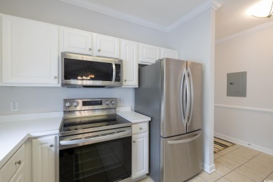 Check out this pristine 2-bedroom, 2-bath furnished villa on Barefoot Resort and Golf Club  in South Carolina - for sale on GolfHomes.com, golf home, golf lot