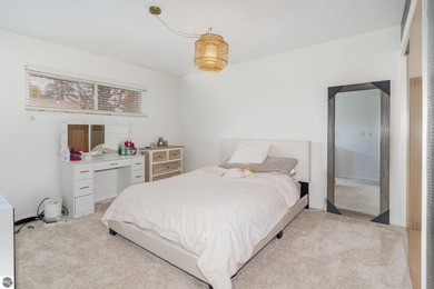 Check out this fantastic 3-bedroom, 2-bathroom brick ranch that on Pine River Country Club in Michigan - for sale on GolfHomes.com, golf home, golf lot