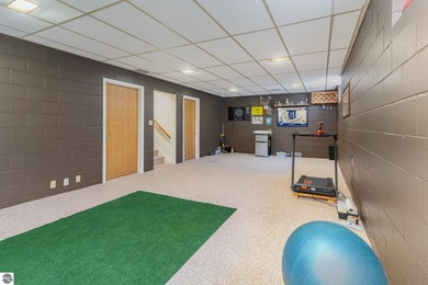 Check out this fantastic 3-bedroom, 2-bathroom brick ranch that on Pine River Country Club in Michigan - for sale on GolfHomes.com, golf home, golf lot