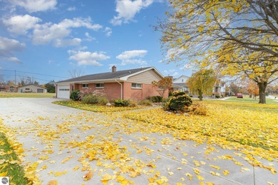 Check out this fantastic 3-bedroom, 2-bathroom brick ranch that on Pine River Country Club in Michigan - for sale on GolfHomes.com, golf home, golf lot