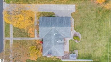 Check out this fantastic 3-bedroom, 2-bathroom brick ranch that on Pine River Country Club in Michigan - for sale on GolfHomes.com, golf home, golf lot