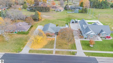 Check out this fantastic 3-bedroom, 2-bathroom brick ranch that on Pine River Country Club in Michigan - for sale on GolfHomes.com, golf home, golf lot