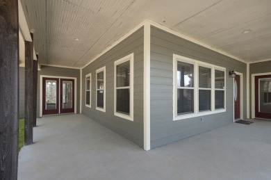 This charming 2-bedroom, 2-bath custom-built home sits on a on Rayburn Country Club in Texas - for sale on GolfHomes.com, golf home, golf lot