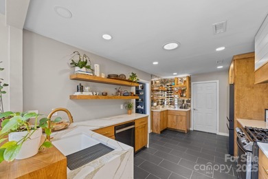 Discover this exceptional end-unit townhome, offering an on Raintree Country Club in North Carolina - for sale on GolfHomes.com, golf home, golf lot