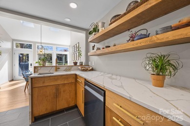 Discover this exceptional end-unit townhome, offering an on Raintree Country Club in North Carolina - for sale on GolfHomes.com, golf home, golf lot