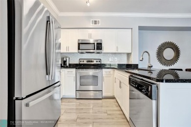 Welcome to this updated condo in Emerald Dunes, West Palm Beach on Emerald Dunes Golf Club in Florida - for sale on GolfHomes.com, golf home, golf lot