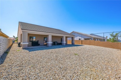 Gorgeous 2022-built home located on the Hukan Golf Course in the on Desert Lakes Golf Course in Arizona - for sale on GolfHomes.com, golf home, golf lot