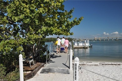 Gorgeous, bright, first floor, 3/2 end-unit with serene preserve on Bonita Bay West in Florida - for sale on GolfHomes.com, golf home, golf lot