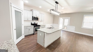 Welcome to this beautifully updated 5-bedroom, 3-bath on Canongate At Heron Bay in Georgia - for sale on GolfHomes.com, golf home, golf lot