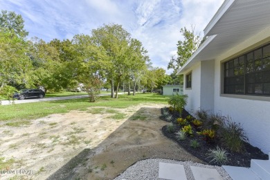 Situated on three lots, this prime Ormond Beach location is just on Riviera Country Club in Florida - for sale on GolfHomes.com, golf home, golf lot