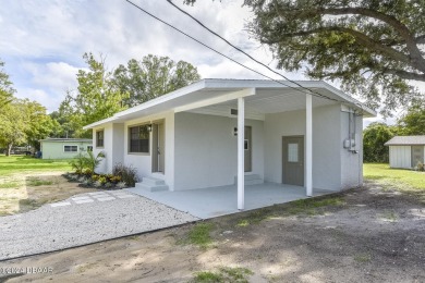 Situated on three lots, this prime Ormond Beach location is just on Riviera Country Club in Florida - for sale on GolfHomes.com, golf home, golf lot