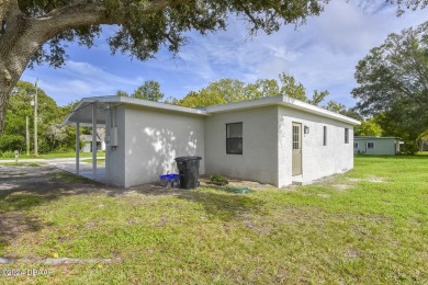 Situated on three lots, this prime Ormond Beach location is just on Riviera Country Club in Florida - for sale on GolfHomes.com, golf home, golf lot