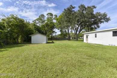 Situated on three lots, this prime Ormond Beach location is just on Riviera Country Club in Florida - for sale on GolfHomes.com, golf home, golf lot