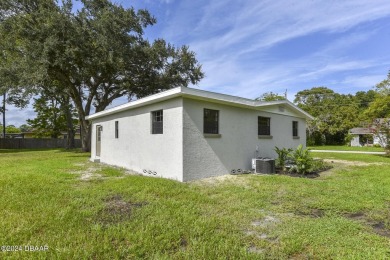 Situated on three lots, this prime Ormond Beach location is just on Riviera Country Club in Florida - for sale on GolfHomes.com, golf home, golf lot