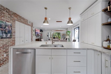 Experience luxury living in this stunning corner unit in Boca on Boca Lago Golf and Country Club in Florida - for sale on GolfHomes.com, golf home, golf lot