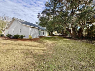 Come take a look at this handsome move in ready home in The on Wedgefield Plantation Golf Club in South Carolina - for sale on GolfHomes.com, golf home, golf lot