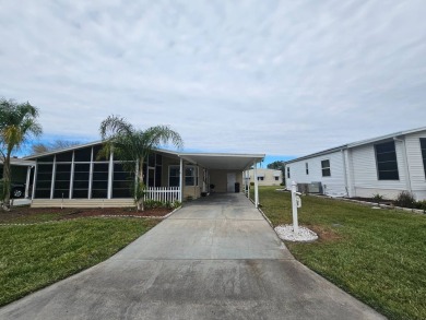 This immaculate 2-bedroom, 2-bath home has vinyl plank flooring on Big Cypress Golf and Country Club in Florida - for sale on GolfHomes.com, golf home, golf lot