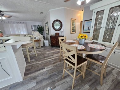 This immaculate 2-bedroom, 2-bath home has vinyl plank flooring on Big Cypress Golf and Country Club in Florida - for sale on GolfHomes.com, golf home, golf lot