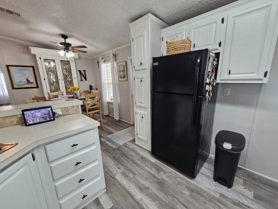 This immaculate 2-bedroom, 2-bath home has vinyl plank flooring on Big Cypress Golf and Country Club in Florida - for sale on GolfHomes.com, golf home, golf lot