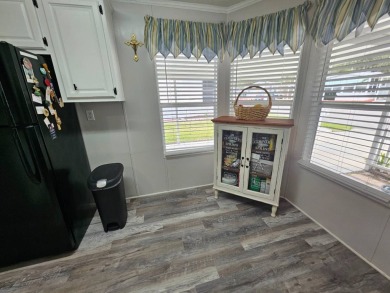 This immaculate 2-bedroom, 2-bath home has vinyl plank flooring on Big Cypress Golf and Country Club in Florida - for sale on GolfHomes.com, golf home, golf lot