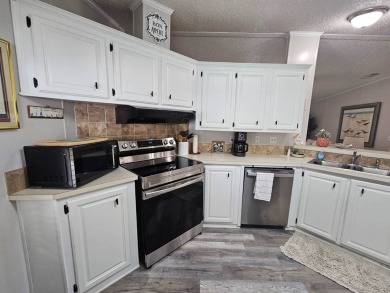 This immaculate 2-bedroom, 2-bath home has vinyl plank flooring on Big Cypress Golf and Country Club in Florida - for sale on GolfHomes.com, golf home, golf lot