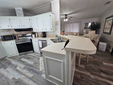 This immaculate 2-bedroom, 2-bath home has vinyl plank flooring on Big Cypress Golf and Country Club in Florida - for sale on GolfHomes.com, golf home, golf lot