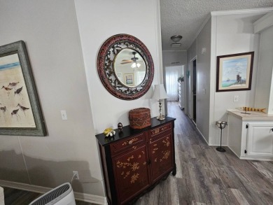 This immaculate 2-bedroom, 2-bath home has vinyl plank flooring on Big Cypress Golf and Country Club in Florida - for sale on GolfHomes.com, golf home, golf lot