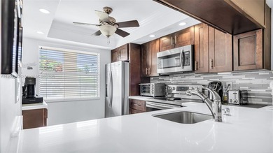 Enjoy resort-style living in this fully renovated 2-bed, 2-bath on Wynmoor Golf Course in Florida - for sale on GolfHomes.com, golf home, golf lot