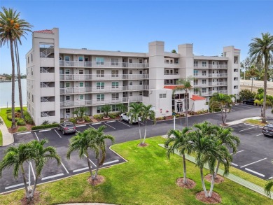Your tropical waterfront living on Boca Ciega Bay awaits! Escape on Isla Del Sol Yacht and Country Club in Florida - for sale on GolfHomes.com, golf home, golf lot