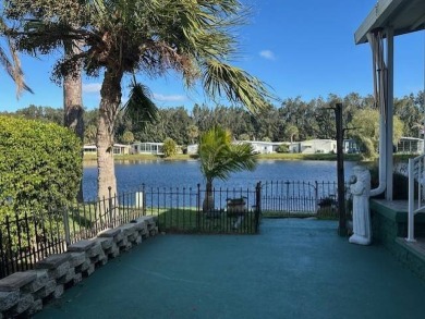 Beautifully Renovated 2-Bedroom, 2-Bath Home with Stunning Lake on Vista Plantation Golf Club in Florida - for sale on GolfHomes.com, golf home, golf lot