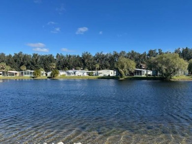 Beautifully Renovated 2-Bedroom, 2-Bath Home with Stunning Lake on Vista Plantation Golf Club in Florida - for sale on GolfHomes.com, golf home, golf lot