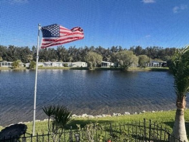 Beautifully Renovated 2-Bedroom, 2-Bath Home with Stunning Lake on Vista Plantation Golf Club in Florida - for sale on GolfHomes.com, golf home, golf lot