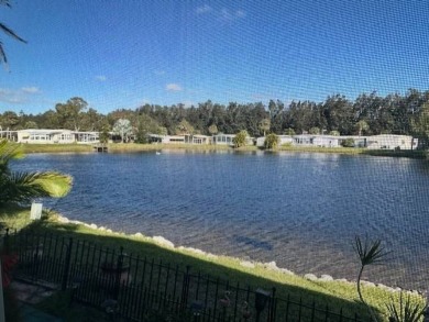 Beautifully Renovated 2-Bedroom, 2-Bath Home with Stunning Lake on Vista Plantation Golf Club in Florida - for sale on GolfHomes.com, golf home, golf lot