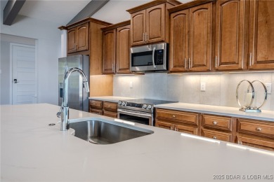 This exceptional 2 bedroom, 2 bath condo has been thoughtfully on Seasons Ridge At Four Seasons in Missouri - for sale on GolfHomes.com, golf home, golf lot