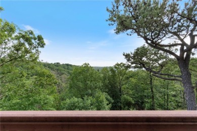 Welcome to luxury! Nestled on nearly an acre across two prime on Holiday Island Golf Course in Arkansas - for sale on GolfHomes.com, golf home, golf lot