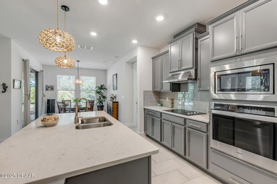 Experience modern elegance and resort-style living in this on Halifax Plantation Golf Club in Florida - for sale on GolfHomes.com, golf home, golf lot