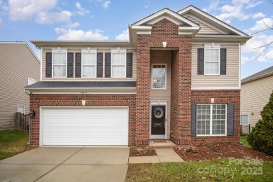 This stunning home is filled with natural light, highlighting on Highland Creek Golf Club in North Carolina - for sale on GolfHomes.com, golf home, golf lot