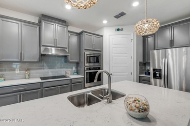 Experience modern elegance and resort-style living in this on Halifax Plantation Golf Club in Florida - for sale on GolfHomes.com, golf home, golf lot