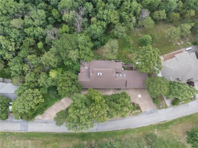 Welcome to luxury! Nestled on nearly an acre across two prime on Holiday Island Golf Course in Arkansas - for sale on GolfHomes.com, golf home, golf lot