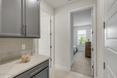 Experience modern elegance and resort-style living in this on Halifax Plantation Golf Club in Florida - for sale on GolfHomes.com, golf home, golf lot