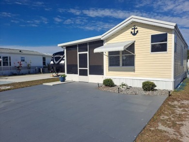This Home Is Immaculate in Everyway ! Situated Right On the Lake on Riverwood Golf Club in Florida - for sale on GolfHomes.com, golf home, golf lot