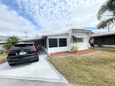 FULLY FURNISHED!!! This home is located in a 55+ community!! on Lone Palm Golf Club in Florida - for sale on GolfHomes.com, golf home, golf lot