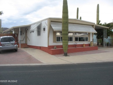Very nice updated and furnished home with laminate flooring on Tucson Estates Golf Course in Arizona - for sale on GolfHomes.com, golf home, golf lot