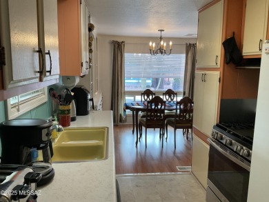 Very nice updated and furnished home with laminate flooring on Tucson Estates Golf Course in Arizona - for sale on GolfHomes.com, golf home, golf lot